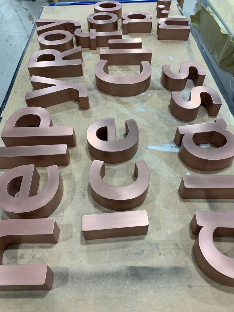 Brass finished signage