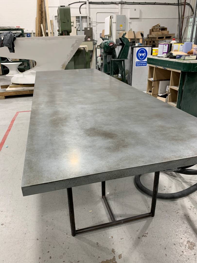 A Dining Table With Patina And A Zinc Finish