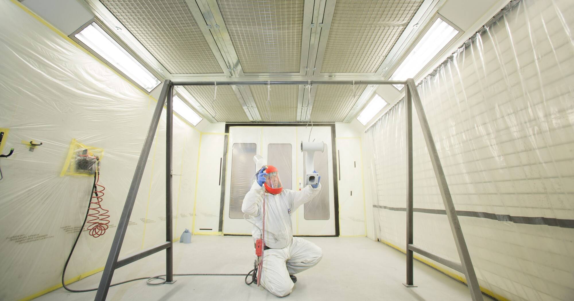 A Team Member Carrying Out Spray Coating