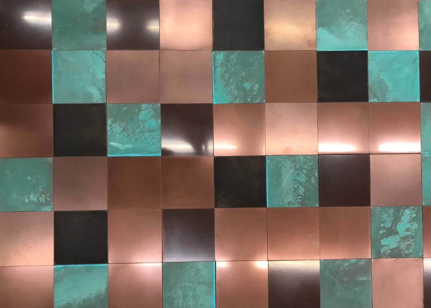 Tiling with a mixture of copper and brass finishes