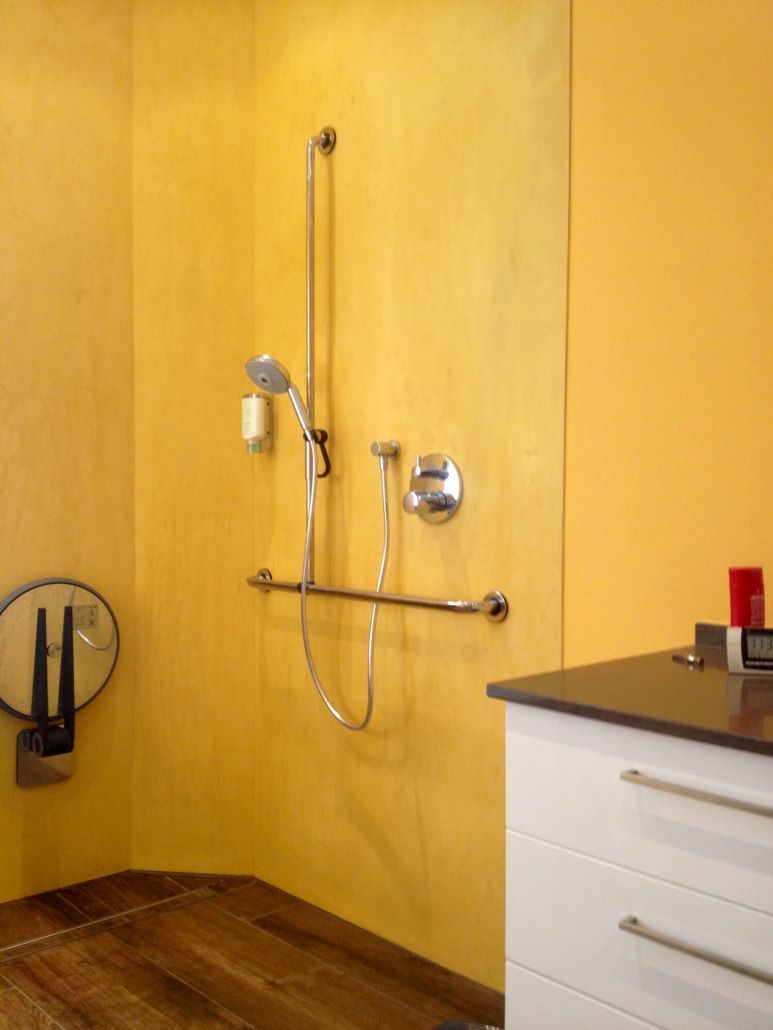 A Microcement Wall and Shower With A Yellow Finish