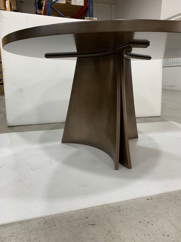 A Table With A Full Brass Coating On It